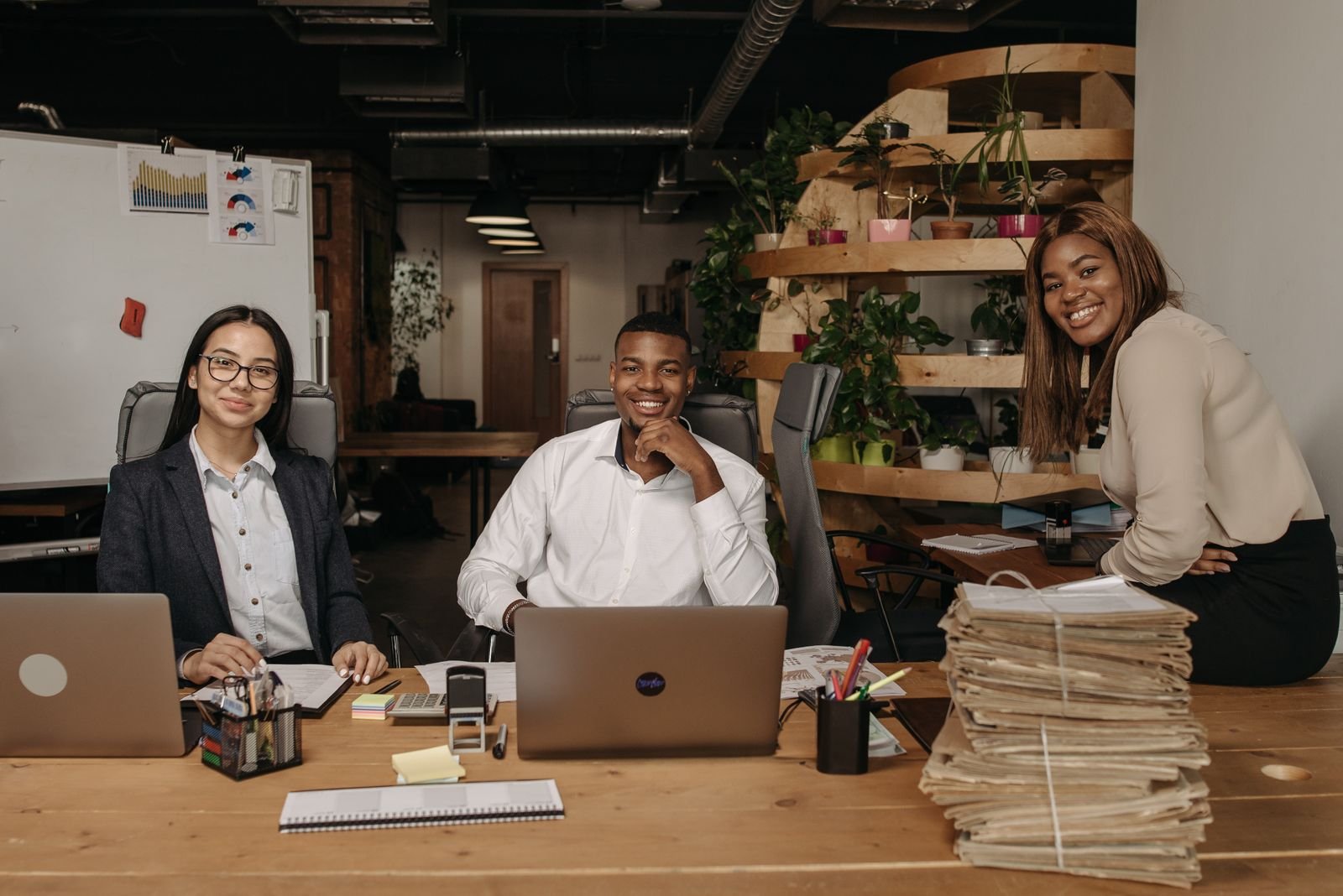 Smiling diverse professionals collaborating in a modern office